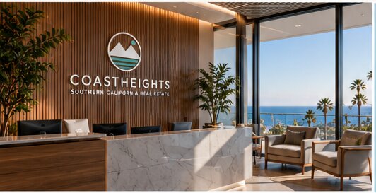 The Coastheights reception area, with a marble desk and an ocean view.